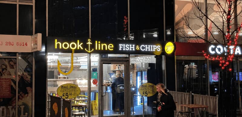 An image of the Hook Line Fish & Chips illuminated outdoor signage.